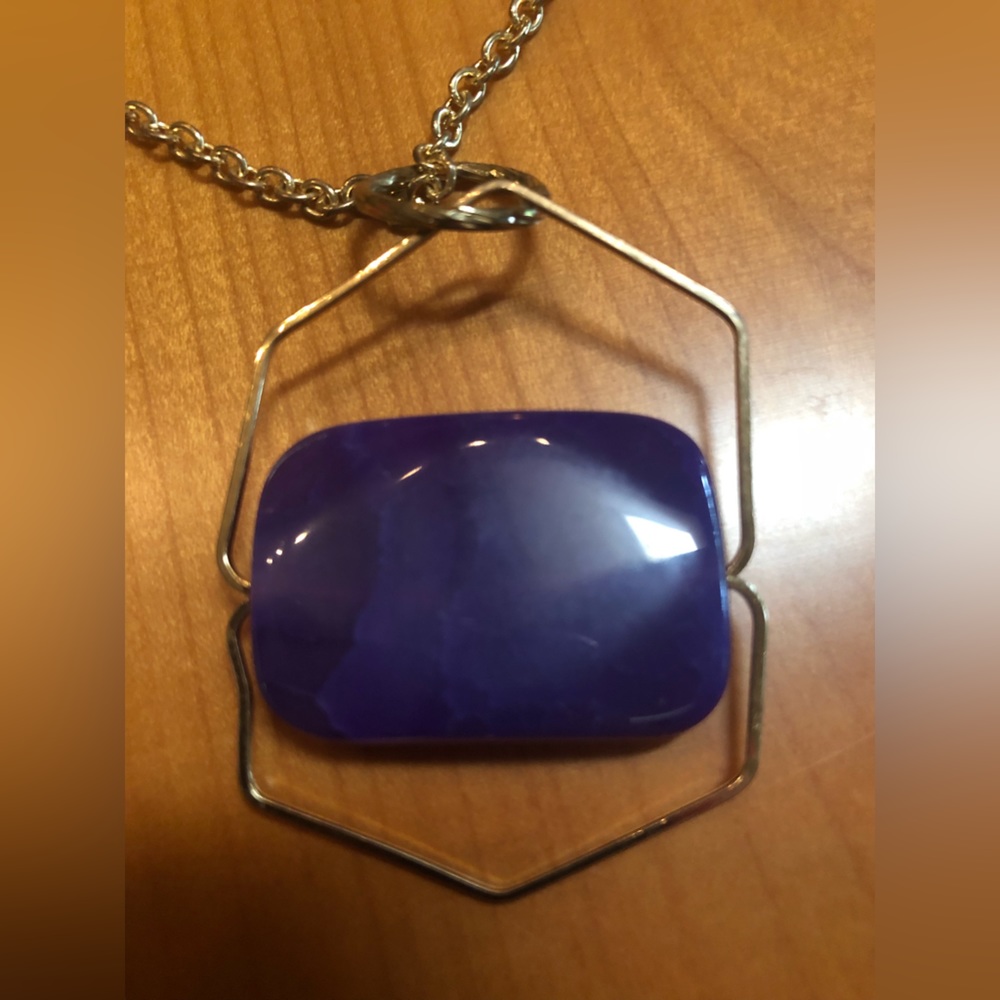 Purple stone gold tone necklace.